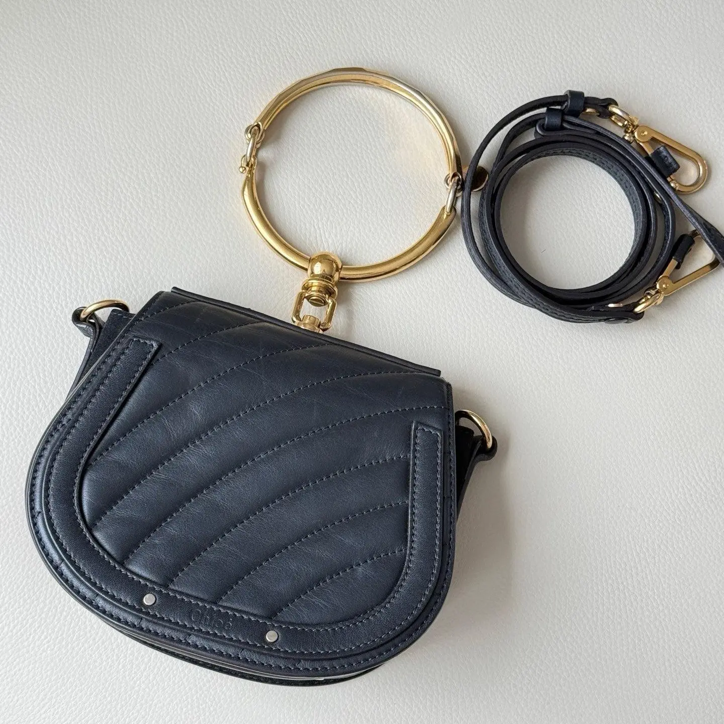 Pre-owned Chloé Nile Small Bracelet Saddle Bag Black Calfskin Striped Suede Gold‑Tone Ring Handle Crossbody 2605322