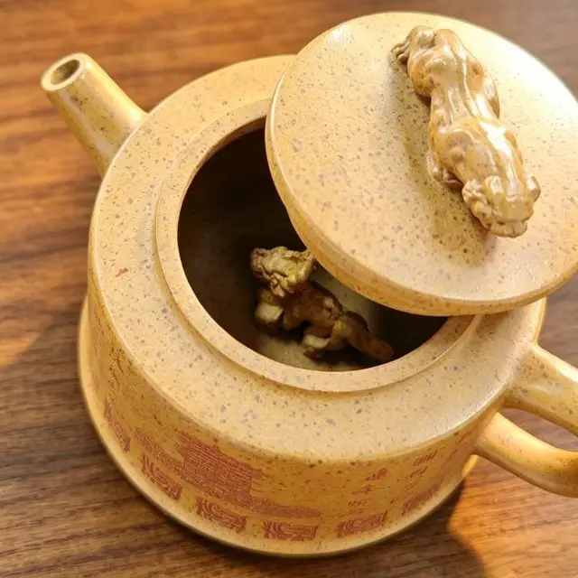 Product Description: Crouching Tiger Hidden Dragon Yellow Crane Tower Zisha Teapot