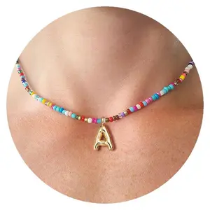 Vacuum plated 18k gold stainless steel colored rice beads 26 letter necklace bubble letter pendant (letter style can be noted)