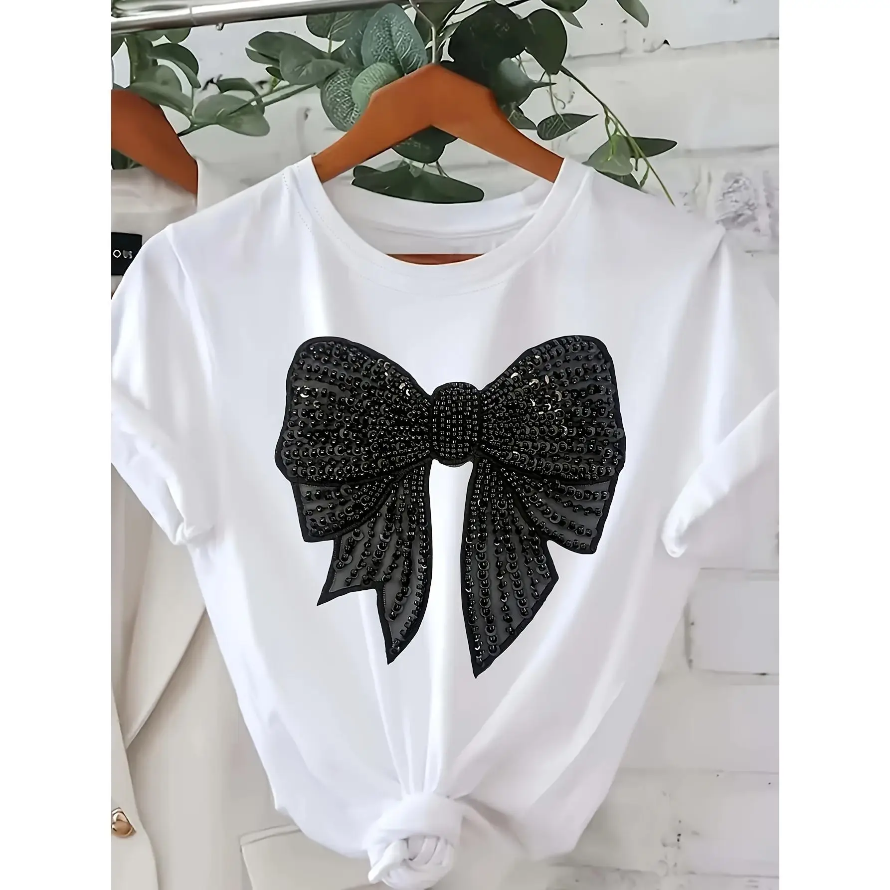 Ladies Elegant White Cotton T-Shirt with Black Bow Print - Casual Crew Neck, Short Sleeves, Loose Version, Machine Washable - Perfect for Spring/Summe