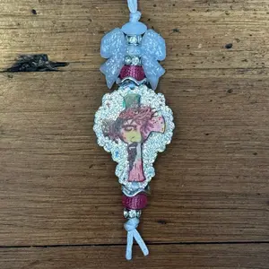 Enhance your vehicle with a Car Charm. A delightful decorative item that adds a touch of charm to your car. Simply hang the charm from your vehicle's rear view mirror or anywhere you choose.