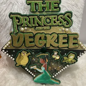 The Princess and the Degree Graduation Cap Topper with Glittery Green and Gold Design and Pearl Accents