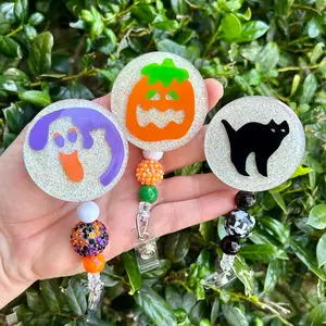 Halloween Cookie Badge Reel with ghost, pumpkin or cat picture attached to an alligator clip or slide on reel