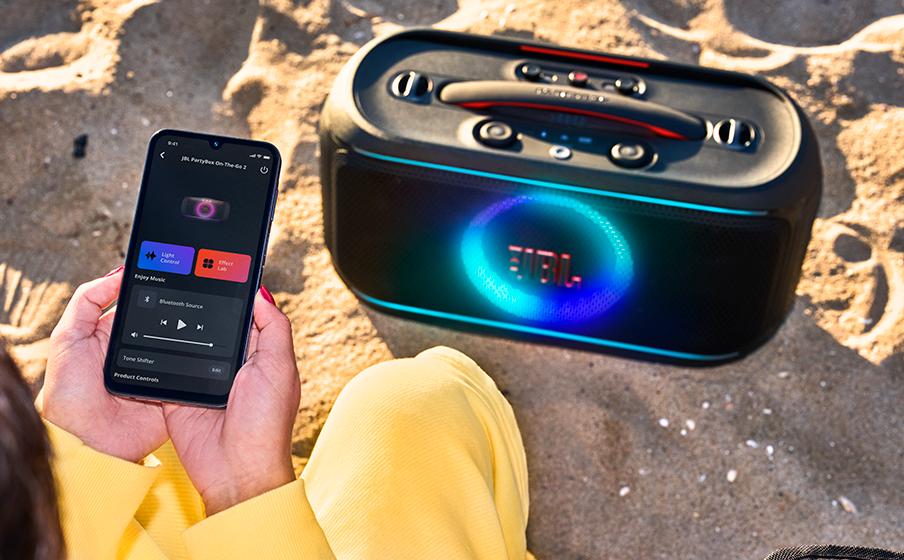 JBL PartyBox On-the-Go 2 Plus, Portable party speaker with real-time AI vocal removal, a wireless mic, powerful JBL Pro Sound, a dynamic lightshow, up to 15 hours of playtime, and a replaceable battery, plus a handle and shoulder strap JBL PartyBox On-the-Go 2 Plus, Portable party speaker with real-time AI vocal removal, a wireless mic, powerful JBL Pro Sound, a dynamic lightshow, up to 15 hours of playtime, and a replaceable battery, plus a handle and shoulder strap