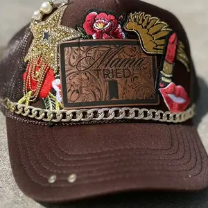 Mama Tried Trucker hat with gold and red accents.