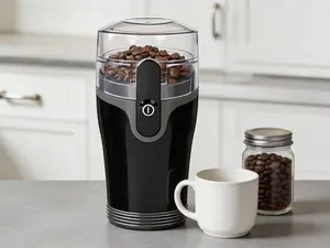 Multifunctional electric grinder for coffee beans, spices and dry foods. Built with stainless steel blades and a removable grinding chamber, supports up to 12 servings, finished in black.