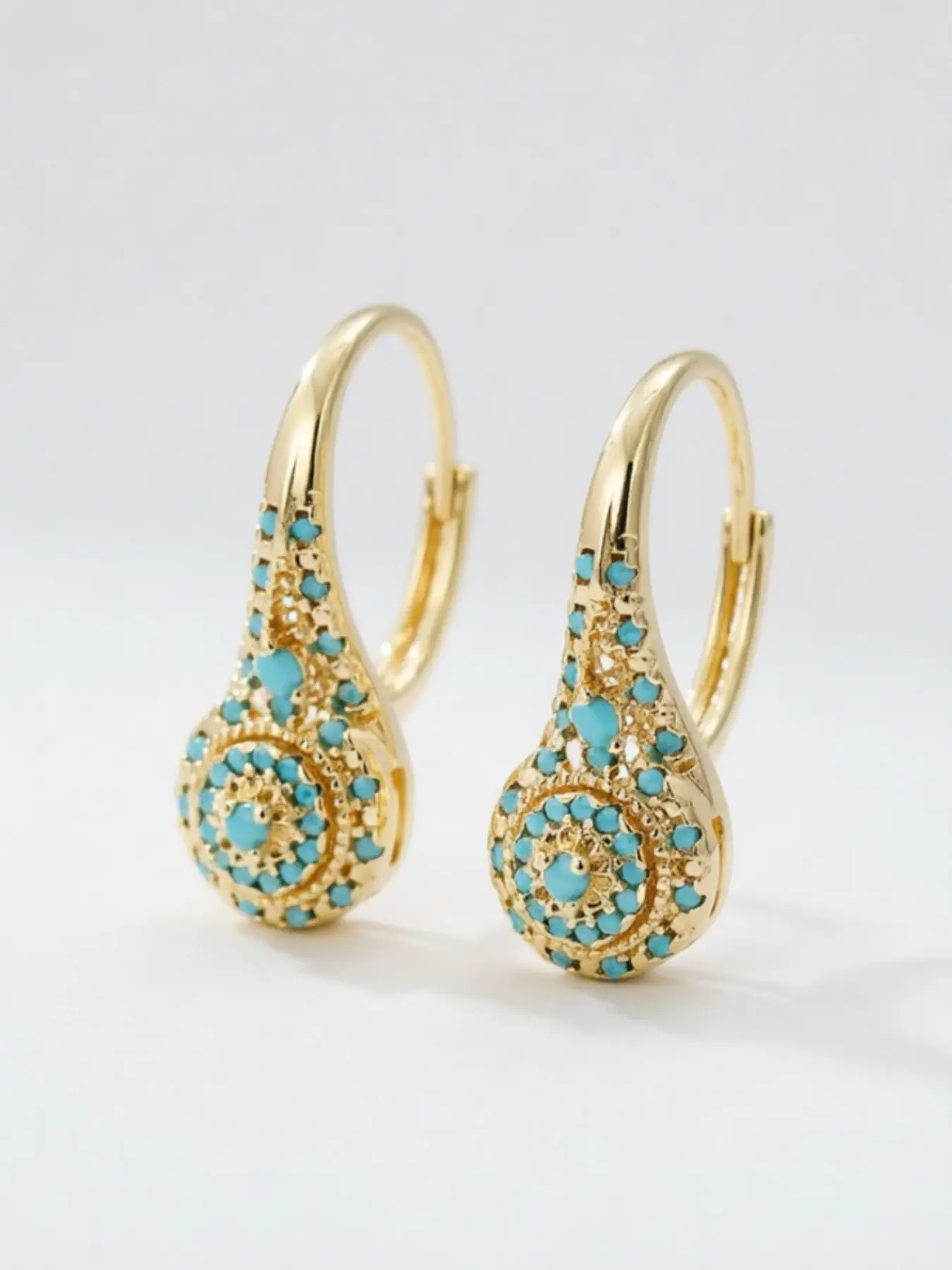 These synthetic turquoise teardrop-shaped pendant earrings, Statement earrings, are eye-catching accessories for everyday and formal occasions, and also make a great Valentine's Day gift. They are affordable, and meticulously crafted