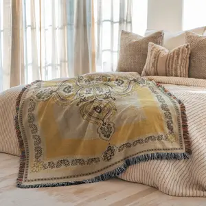 American retro-style jacquard woven fringed blanket, with symmetrical center pattern, in classic warm tones of yellow, beige and black. Suitable for use as a bed curtain, tapestry or sofa cover for various cozy home decorations.