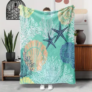 An ocean-themed flannel blanket with starfish, shell, and coral designs - allergy-free all-season beach-style bedding, machine washable, digitally printed, multi-functional polyester woven blanket for sofa, bed, and office use