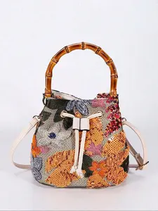 Atmosphere sense, fashionable sequin embroidery decoration, color blocked bucket bag, retro light luxury, exquisite and personalized hand-held crossbody bag, chain shoulder strap design, suitable for attending parties and dinners