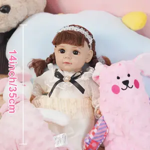 VACOS 14inch Reborn Baby Doll: Soft cotton body, delicate lace dress with black bow, sparkling brown eyes, & a lace headband. Perfect for holidays & kids’ milestones!