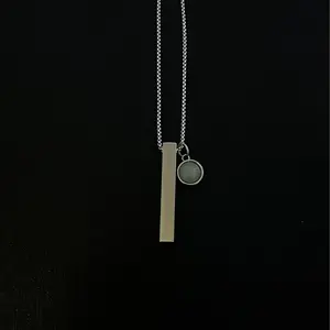 The Exception- Pendant Necklace with Sleek Minimalist Design, Vibrant Green Jewel at Center, Celebrates Individuality and Strength