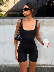Minimalist Solid Color Sporty Jumpsuit. Backless Slim Fit Black Tank Top. Hot Girl High Waist Yoga Shorts. Summer Active Hot Pants Bodysuit as inner wear or outer wear.Trendy Streetwear Athleisure Outfit. Backless Sports Jumpsuit