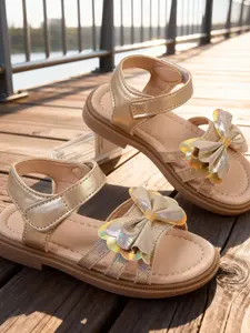 Girls' Sequined Bow Sandals - Soft Upper & TPR Outsole. These golden glittering toddler summer shoes come with adjustable laces, suitable for parties and daily wear.