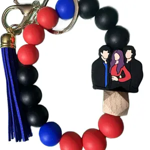 Vampire Diaries keychain featuring Damon, Elena, and Stefan