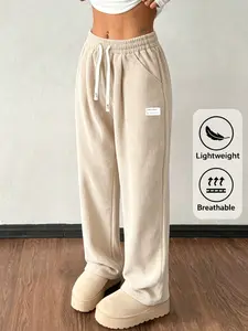 Women’s corduroy pants with a high waist and wide legs, drawstring design, fabric tag decoration, full-length pants. Casual street style; casual pants for everyday outings/casual gatherings; no specific holiday focus; suitable for spring, autumn, and wint