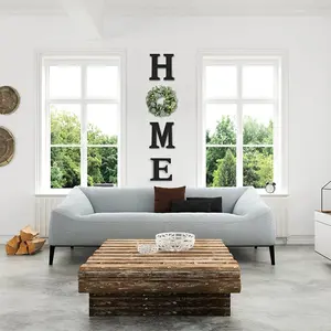 Elegant Wall Sign: Wooden 'Home' Letters with Eucalyptus Wreath. Features: • Modern Farmhouse Style • Pre-Assembled & Ready to Hang • Perfect as Housewarming, Wedding, or Christmas Gift