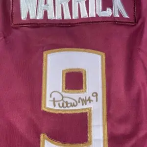 Peter Warrick autographed jersey with JSA authentication I burgundy or white.