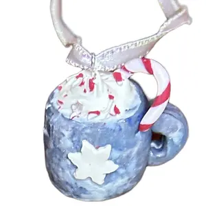 Small cocoa hot chocolate with whipped cream and candy cane clay in a blue mug with snowflake emblem holiday hanging Christmas tree ornament Decoration Gift Decor
