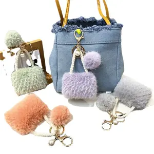 2pc Luxury Mini Tote Bag Keychain Wallet with Pom-pom & Pendant Color & Style: Boasts soft color tones, exuding a lovely vibe that makes it an ideal gift for women.
