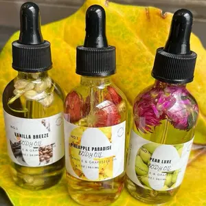 {NEW} ILLUMINATING BODY OIL: Available in Pineapple, Vanilla, Strawberry, and Peaches & Cream (Champagne Kiss). Keeps your skin moisturized and silky soft. Smells amazing, the scent is very long lasting.