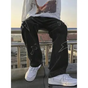 Men’s distressed black denim jeans with lightning cross embroidery, plain hem, casual menswear