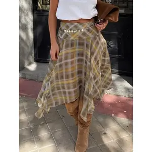 Women’s plaid asymmetrical midi skirt with a high waist and a flowy handkerchief hem, made from soft, lightweight fabric; retro street style; casual spring and autumn wear GARMENTARY