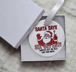 Santa Says Six Seven 6 7 Christmas Ornament with Fun Math Joke Design and White Ribbon for Festive Decor Ceramic Ornament with Sublimated Print Perfect for Holiday Decorations