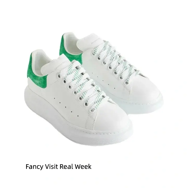 Fresh white platform sneakers with vivid emerald green suede heel, eye-catching spring casual footwear #ChunkySneakers #WhitePlatformShoes #SpringDailyShoes