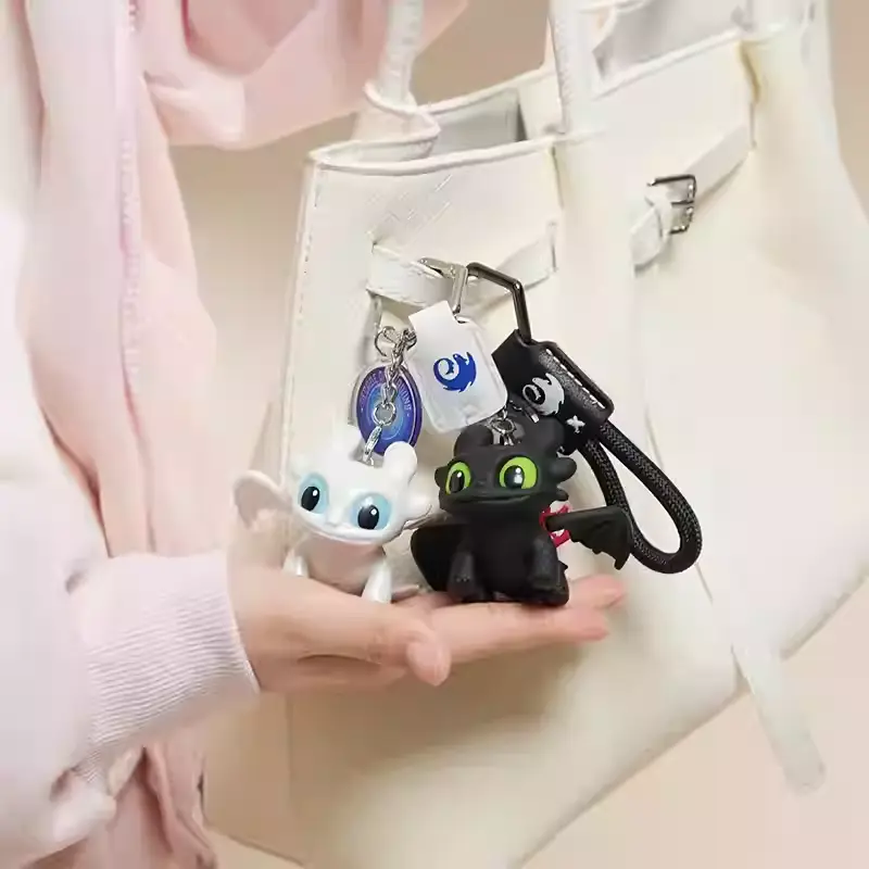 Light-Up Cartoon Dragon Eye Keychain with LED Light Rechargeable Cute PVC Dragon Bag Charm for Keys Backpacks Purses Gifts Fun Flashing Eye Light Accessory Decor Hanging Lightweight Ornament