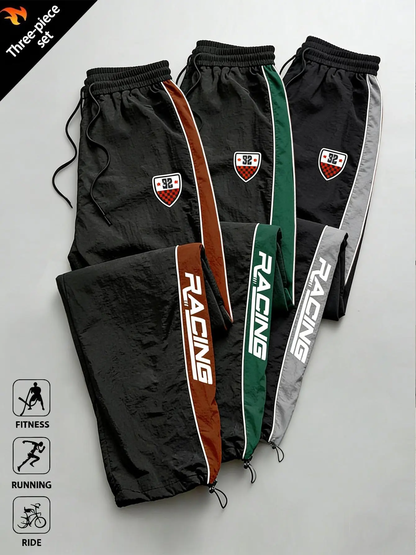 Men’s black-and-red racing stripe pants — street sport, retro racing style; elastic waistband; clean fit; black racing logo pants; minimalist relaxed look plus a slightly mature commuter vibe; versatile for everyday wear; racing sports style; loose wide-l