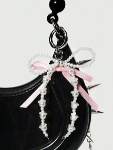Sweet and exquisite pearl bow pendant, exquisite and fashionable small fresh sweet cool mobile phone case keychain, beaded lanyard ccd camera bag pendant handmade personality creative all-match Keychain For Bags