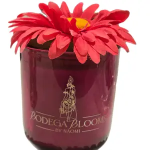 Bodega Blooms by Naomi Ms. Vivienne Home Decor Candle with Pink & Yellow Floral lid.