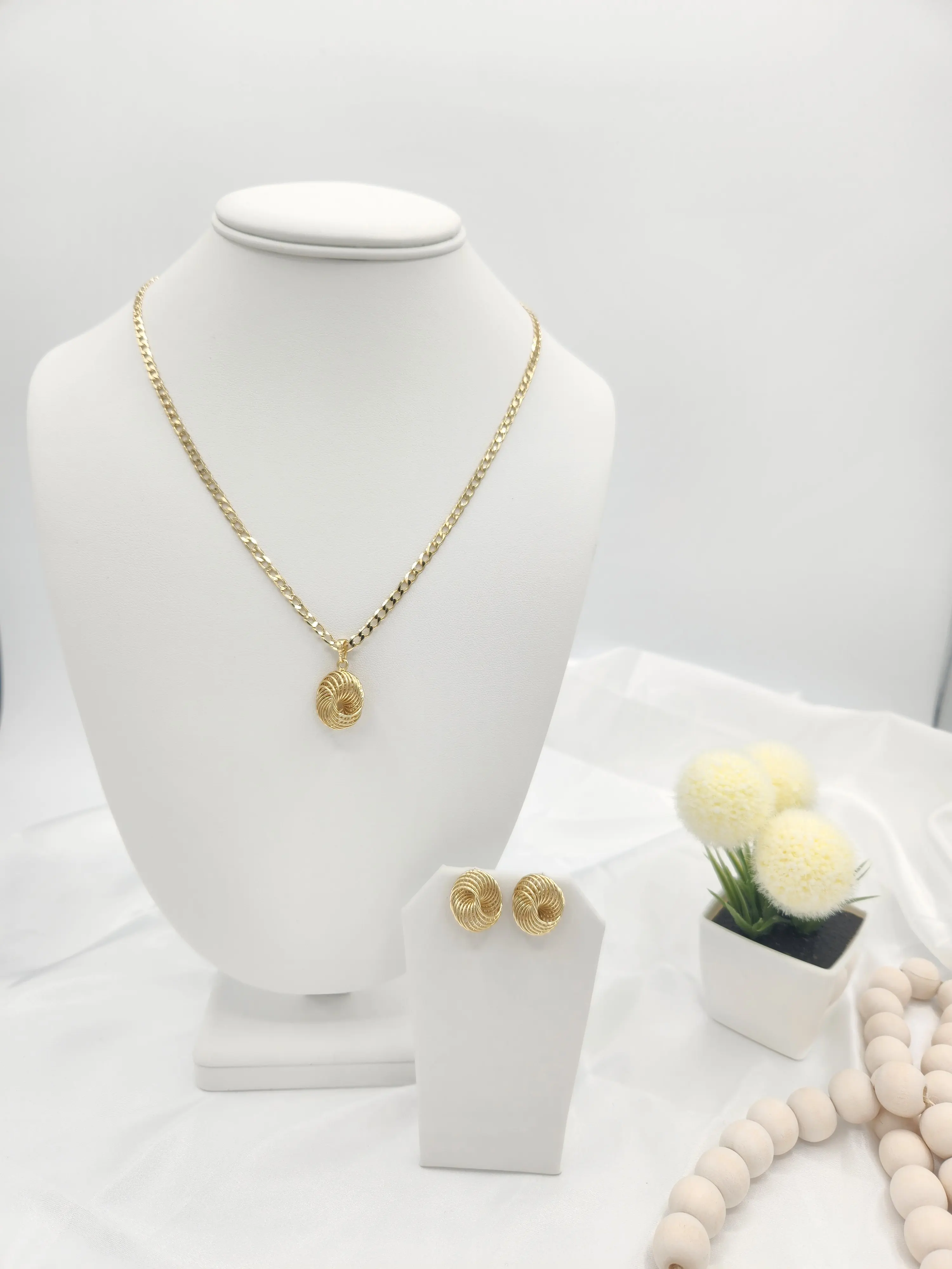 14K gold plated Cuban link chain and earring set for women.