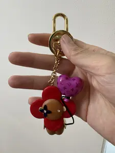Pre-owned Louis Vuitton metal and wood Bag Accessories vivian keychain