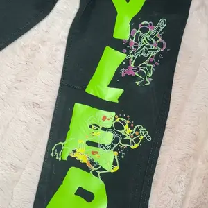 Custom Birthday Outfit with Neon Green "BIRTHDAY" Design and Colorful Splash Pattern