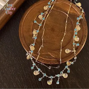 Women's Gold-Plated Blue Crystal & Shell Jewelry Set - Delicate Necklace, Dainty Drop Charm Choker, Stackable Clavicle Chain, Bracelet, Luxury Beach Vacation Picnic Accessory