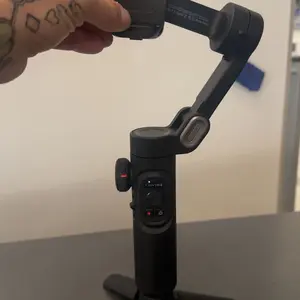 Product Review of Handheld 3 Axis Anti-shake Shooting Stand (1 Count), Rotating Automatic Face Tracking Tripod Stabilizer for Live Video, Phone Accessories, Content Creator Tools from I**s