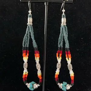 Navajo handmade beaded earrings adorned with dark harbor green with fire designed seed beads and magnesite Turquoise, silver plated basket beads and silver daisy shaped beads.