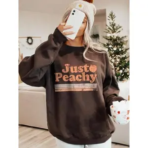 Women’s “Just Peachy” letter print crewneck sweatshirt, casual long-sleeve pullover for fall and winter, loose fit, polyester blend