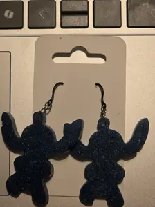 island blue alien outline  plastic dangly earrings