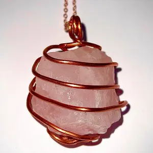 Pink Quartz Raw Crystal Pendant wrapped in pure copper wire, on a rose gold plated copper necklace.