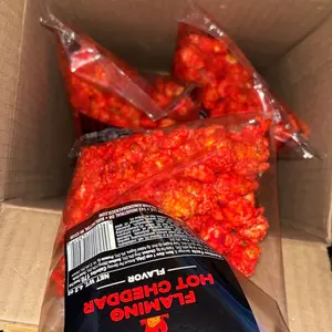 Junior Snacks Co. Hot Cheddar Popcorn; Yellow Cheddar meets our Spicy Red Seasoning