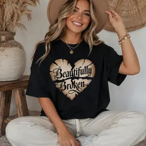 Gothic "Beautifully Broken" Cracked Heart Graphic Tee Blackletter Script "Beautifully Broken" Casual Cotton Shirt Dark Aesthetic "Beautifully Broken" Crew Neck Edgy Cracked Heart "Beautifully Broken" Everyday Wear Top