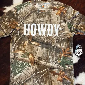 Howdy Camo T Shirt with "HOWDY" Text and Camouflage Design by Howdy Brand