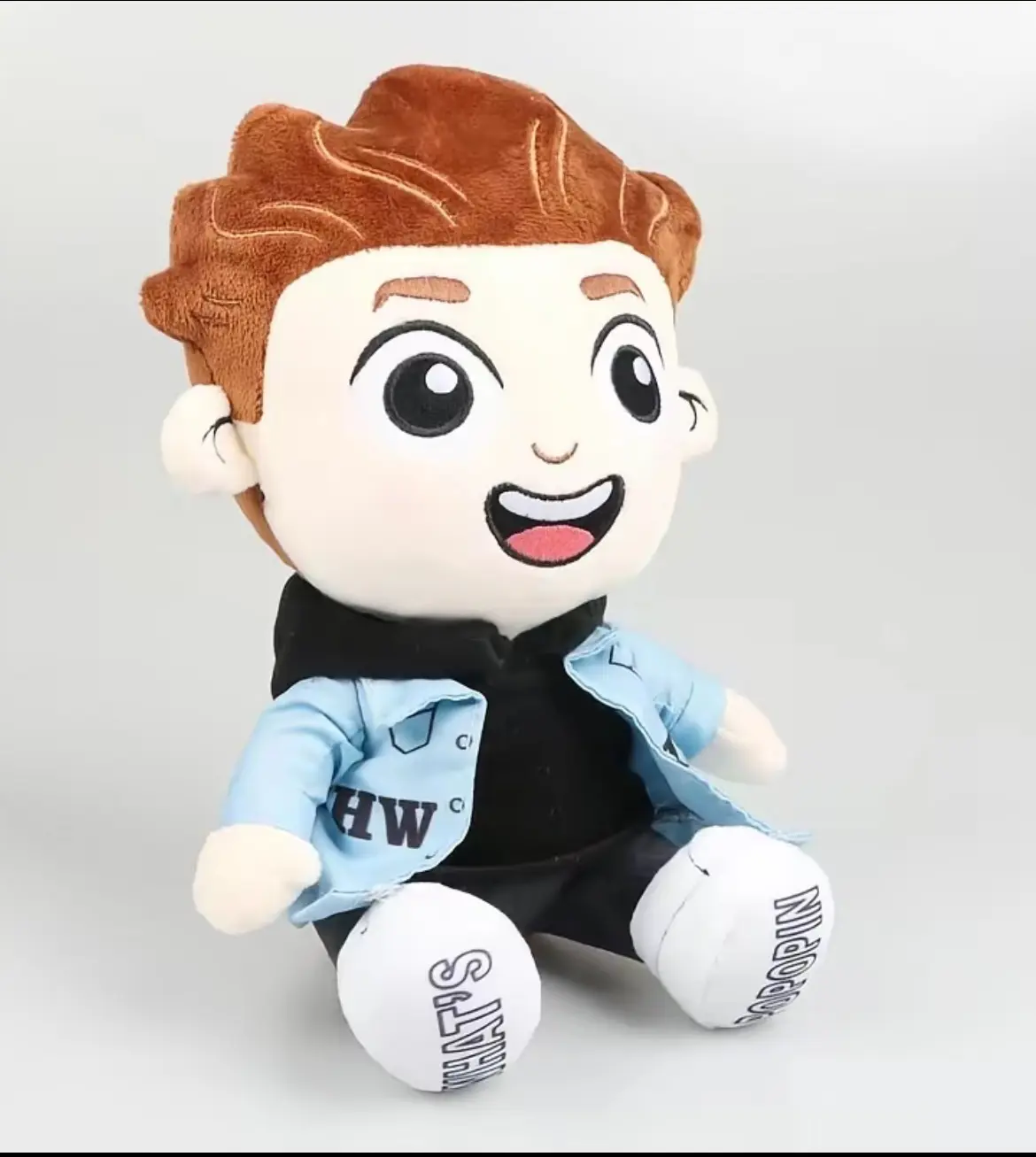 Cute Chibi Plush Doll with Brown Wavy Hair and Big Eyes, Soft Stuffed Toy in Blue Open Shirt and Black Outfit, Trendy Collectible Sitting Figure for Aesthetic Desk Decor & Gift Giving