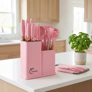 19-piece silicone kitchen utensil set includes a storage box and features a chef's knife, non-stick cookware, non-stick spoons, and a complete cookware set. Suitable for Valentine's Day and other occasions. Available in stylish white and pink.