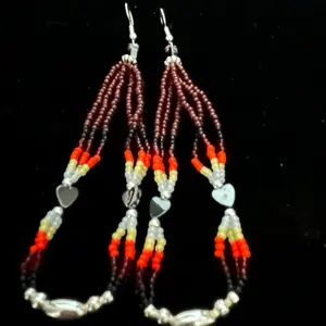 Navajo handmade beaded earrings adorned with brown seed beads, fire design seed beads, hematite heart beads, and silver alloy daisies.