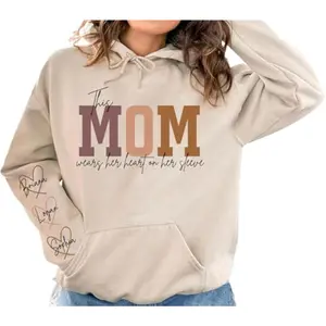 Personalized This Mom Wears Her Heart On Her Sleeve Sweatshirt With Kids Names, Custom Mama Sweatshirt, Mother's Day Gift for Mom, Mama Life Hoodie
