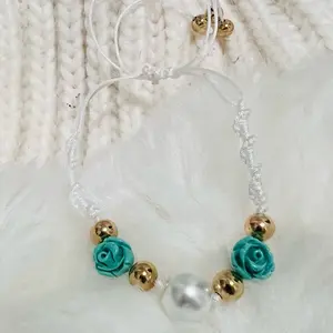 Elegant Beaded Bracelet with Teal Roses and Gold Accents on White Cord for Women's Fashion